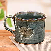 Ceramic cup, 'Lotus Herbage' - Lotus-Themed Teal Celadon Ceramic Cup with a Crackled Finish