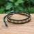 Glass beaded wristband bracelet, 'Peace at the Forest' - Green and Purple Glass Bead and Leather Wristband Bracelet