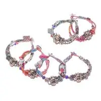 Cotton and brass braided pendant bracelet, 'Tamed Hannya' - Bohemian Hannya-Inspired Assorted Cotton Pendant Bracelet