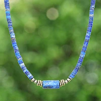 Lapis lazuli and hematite beaded pendant necklace, 'Cylindrical Beauty' - Lapis Lazuli Pendant Necklace with Golden-Hued Hematite Gems