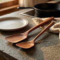 Wood spatulas, 'Time to Eat' (pair) - Pair of Longan Wood Serving Spatulas Hand-Carved in Thailand