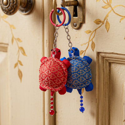 Handmade keychains, 'Shelly Contrast' (set of 2) - 2-Piece Blue & Red Turtle Keychain Set with Glass Beads