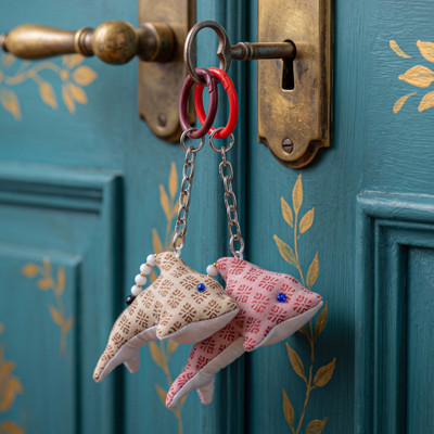 Handmade keychains, 'Gentle Fins' (set of 2) - Brown and Pink 2-Piece Handmade Dolphin-Shaped Keychain Set