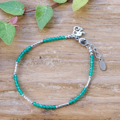 Chalcedony beaded charm bracelet, 'Reliving Ease' - Chalcedony Bracelet with Stainless Steel Elephant Charm